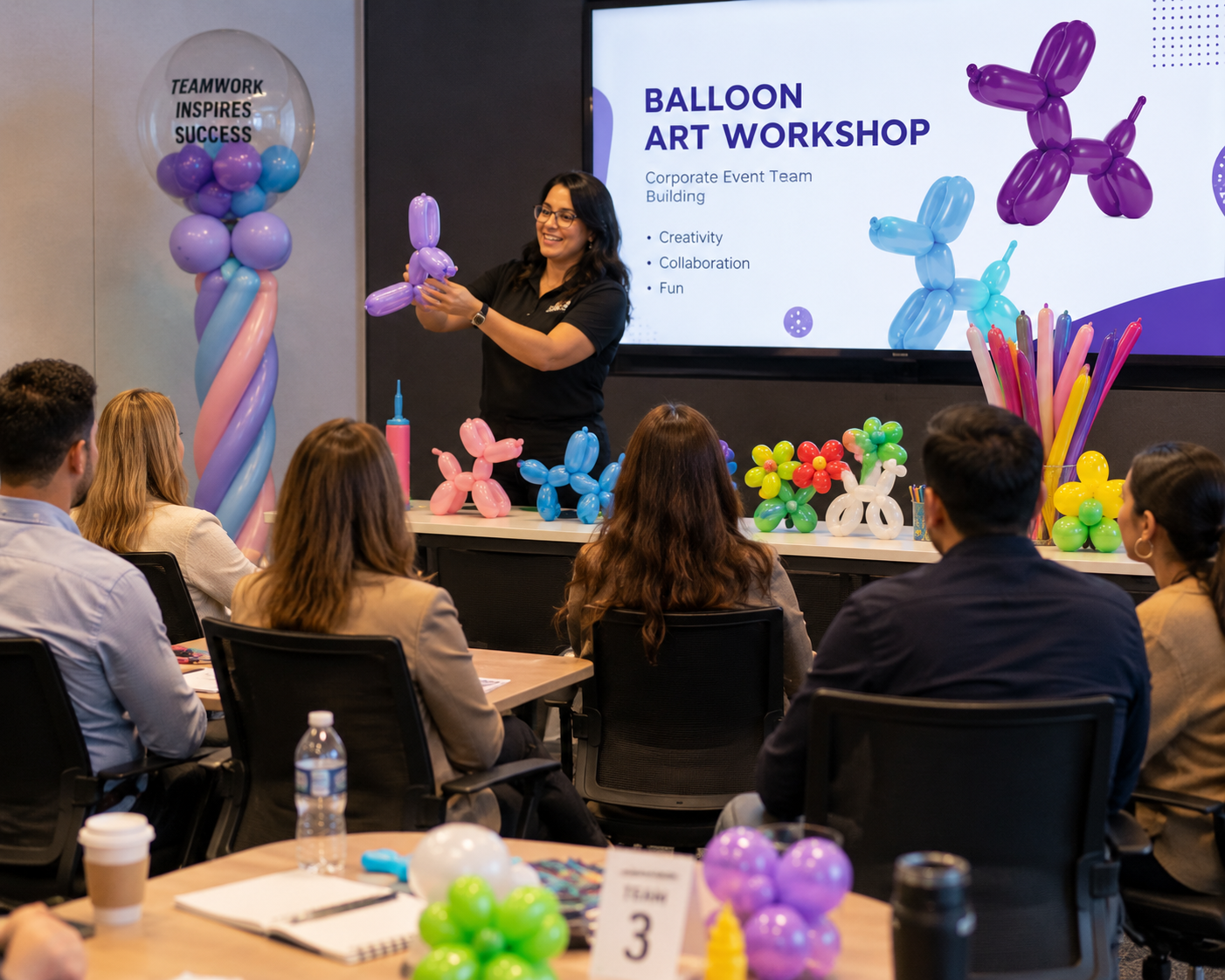 Instructor leading a corporate balloon art workshop for a team in a conference room