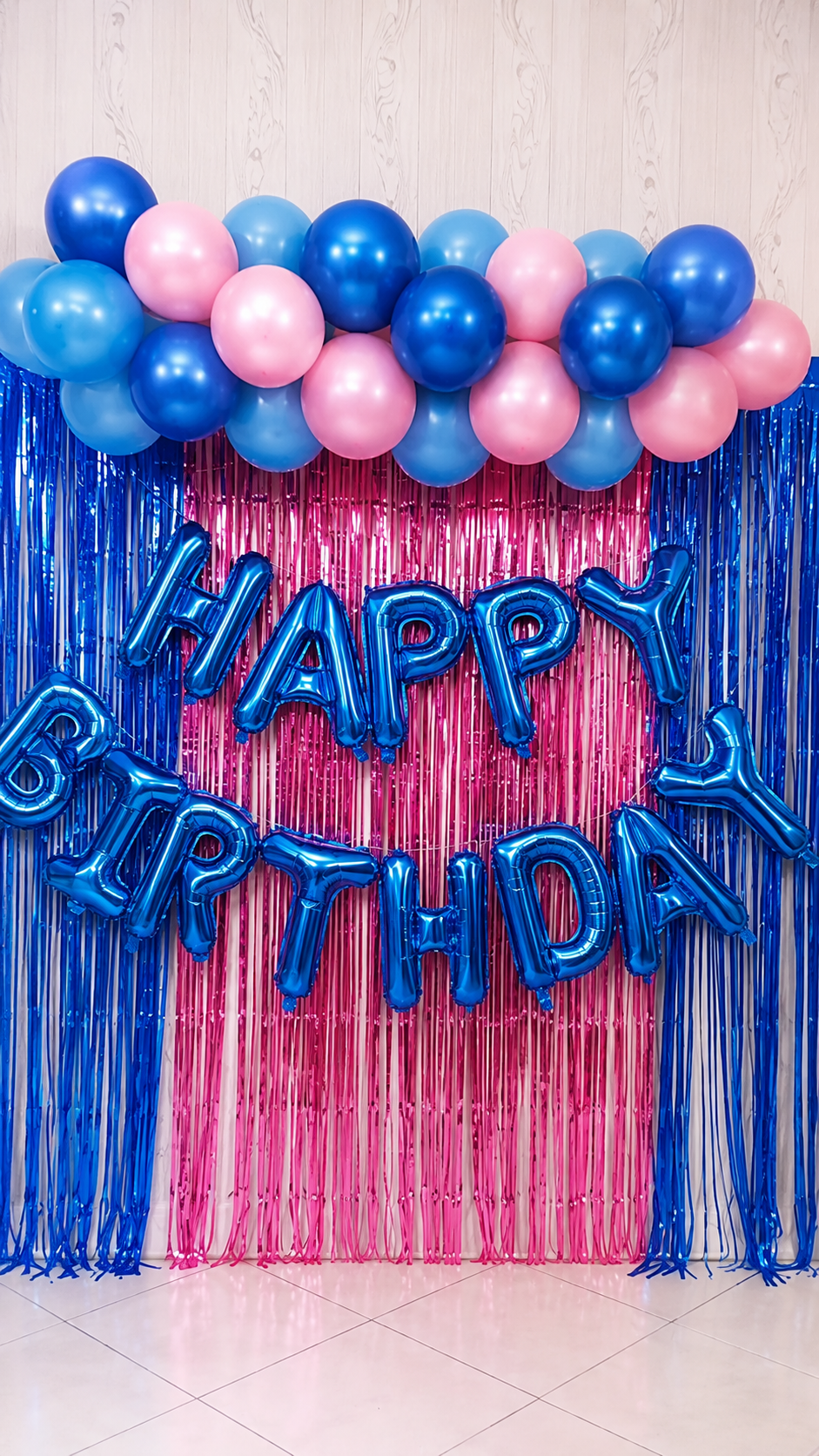 Happy Birthday balloon backdrop with blue and pink balloon garland